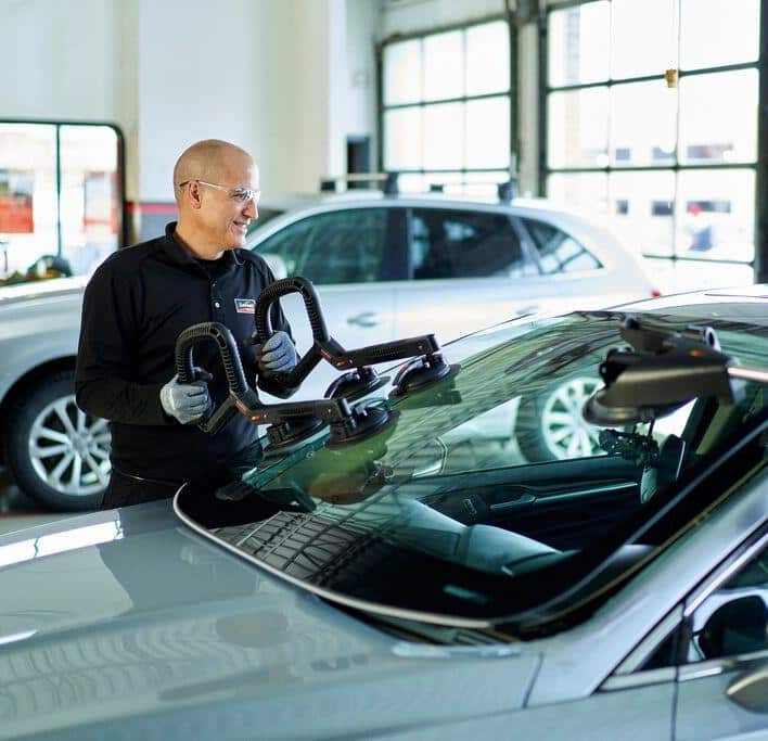 Windshield replacement by a technician